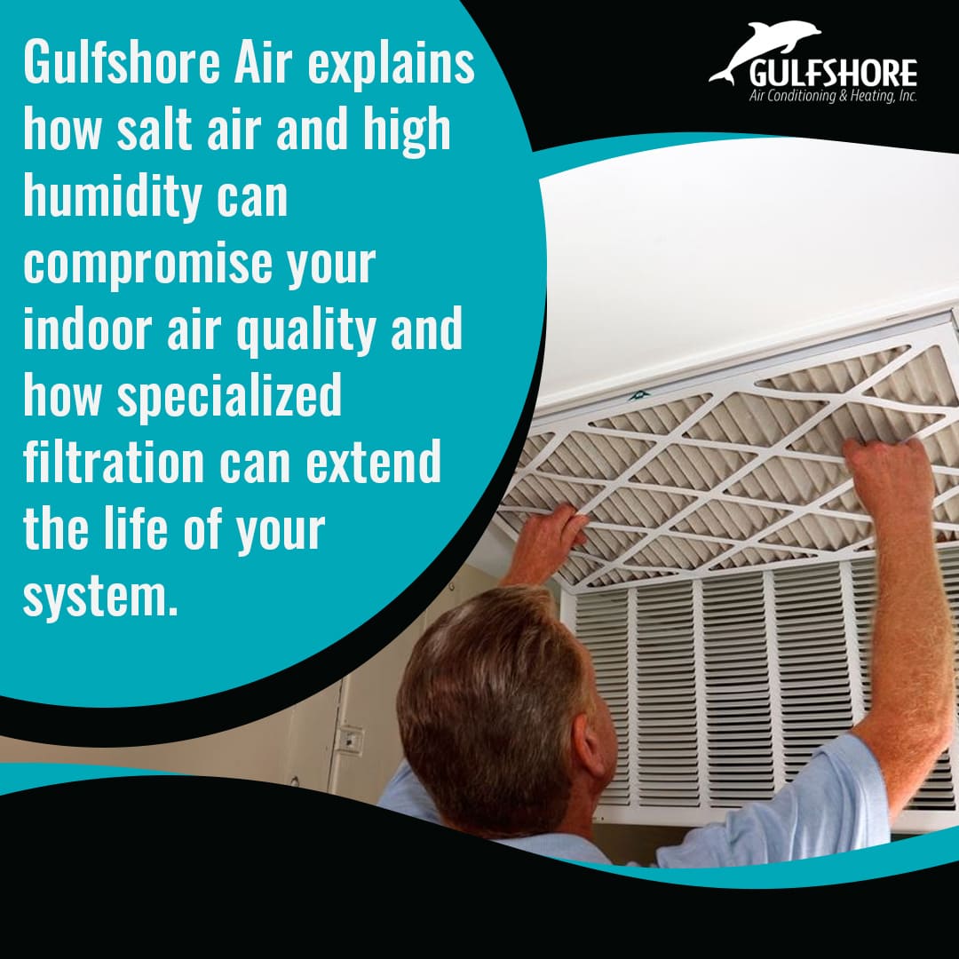 Man replacing HVAC air filter to prevent damage from salt air and high humidity in coastal homes